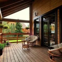 Rattan furniture on a wooden terrace