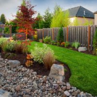 Flowerbed with pebbles in the autumn garden