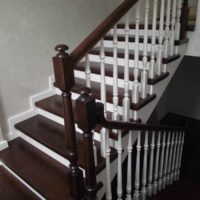 An example of a bright interior of a staircase in an honest house photo