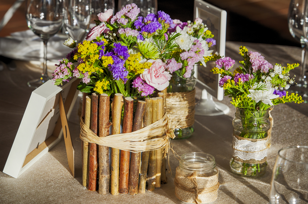 Vase of twigs on a bridal table