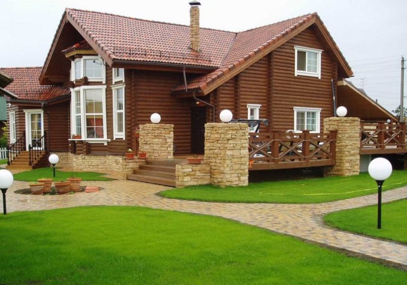 Stone-built log house with outdoor terrace