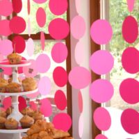 Simple paper garlands in a baby's birthday room