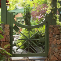 Wooden garden gate with stone pillars