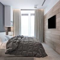 Gray and brown tones in the design of the bedroom