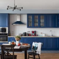 Blue kitchen and black dining table