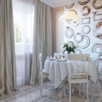 Curtains and wallpapers in the interior of the kitchen