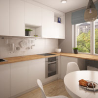 Light gray facades of a kitchen set in a studio apartment