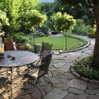 Forged garden furniture on a sandstone site