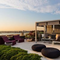 Gazebo with a relaxation area on the roof of a multi-storey building