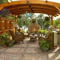 Wicker garden furniture in a wooden arbor