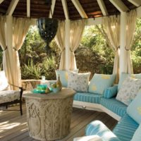 Comfortable pillows in the decor of the garden gazebo