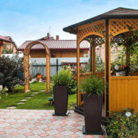 Corner of rest in a country garden with a small arbor