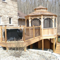 Arbor made of wood on the slope of the plot