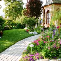 Cement tile path leading to the entrance to the country house