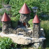 Ancient stone castle in the garden decor