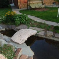 Stone bridge over a garden stream