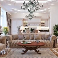 Crystal chandelier on the ceiling of the living room in the neoclassical style