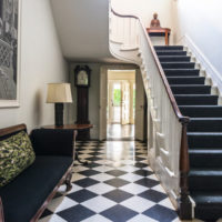 Black carpet on the steps of a staircase in a country house