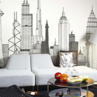 Wallpaper with a pattern of skyscrapers on the wall behind the sofa