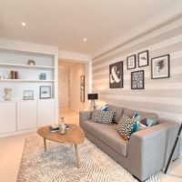 Stripes of gray shades in the design of a bright living room