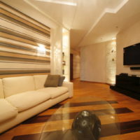 Colorful stripes on the wallpaper in the living room of a private house