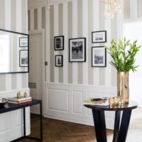 Fresh flowers and striped wallpaper in the interior