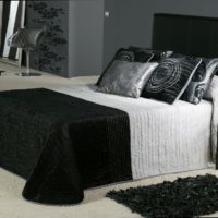 White floor in the bedroom with black furniture