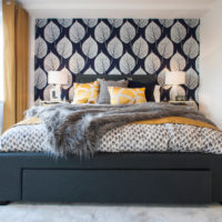 Black bed and light gray bedroom walls