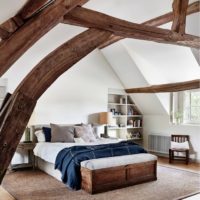 The interior of the bedroom in the attic of a country house