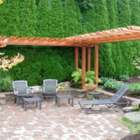 Wooden pergola in the design of the courtyard