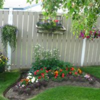 Decoration of a wooden fence with flowers