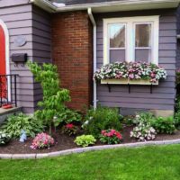 Flowerbed in front of the porch of a private house