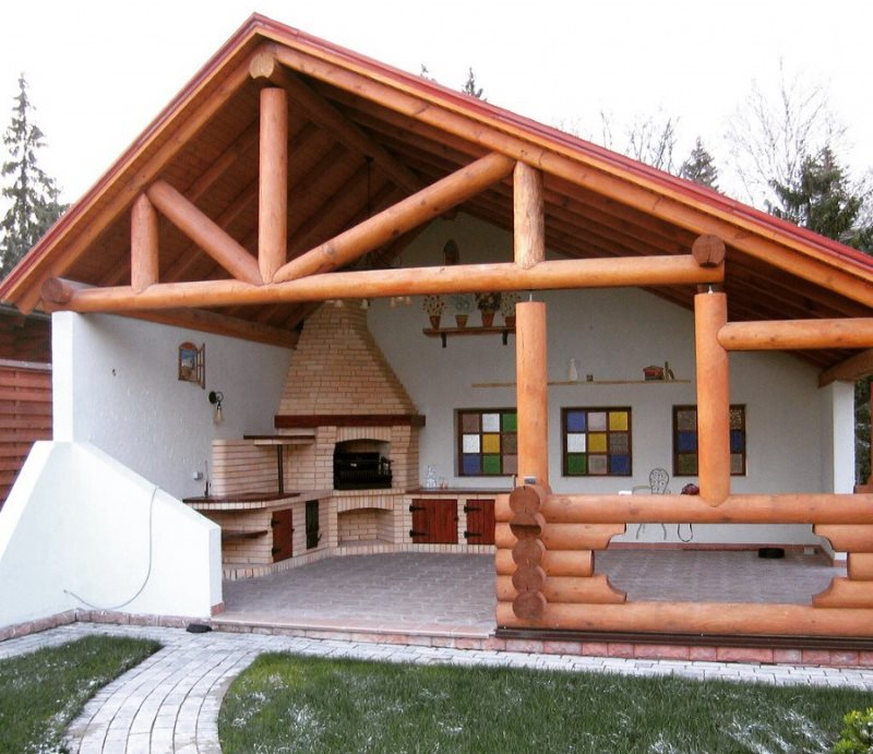 Semi-open summer gazebo with barbecue