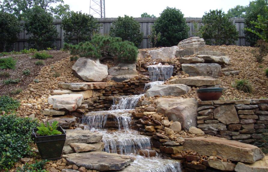 Cascading waterfall in the landscape of a summer cottage