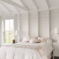 Painted tree in a rustic bedroom interior