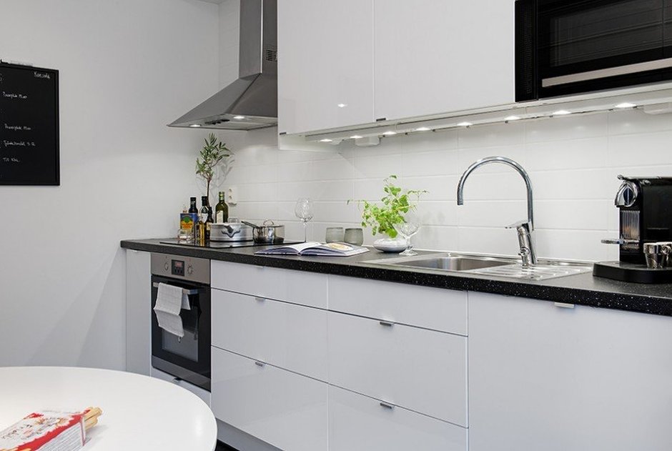 The linear layout of the kitchen in a studio apartment