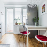 White kitchen interior with brown floor