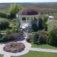 Greek-style gazebo on the edge of the countryside