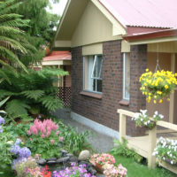 Front garden of a country house with flowering plants