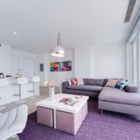 Lilac carpet in front of the panoramic window of the living room