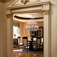 Decoration of the doorway with stucco molding with gilding