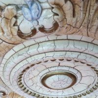 Decorative rosette with stucco on the ceiling of the Gothic bedroom