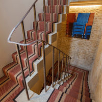 Concrete staircase with metal railing