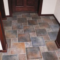 Tile linoleum in the hallway of a city apartment