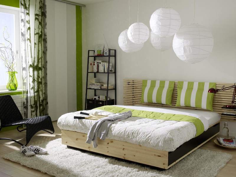 Wooden bed in the bedroom of a city apartment