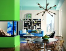 Green fireplace facade in the living room of a country house