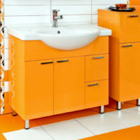 Orange washbasin cabinet in the bathroom