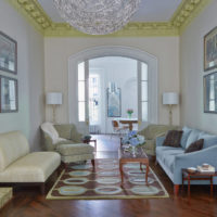 Golden moldings on the ceiling of the living room