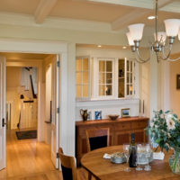 Dining room of a residential building with moldings on the ceiling