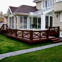 Wooden terrace in the backyard of the cottage